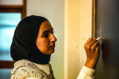 female student at blackboard