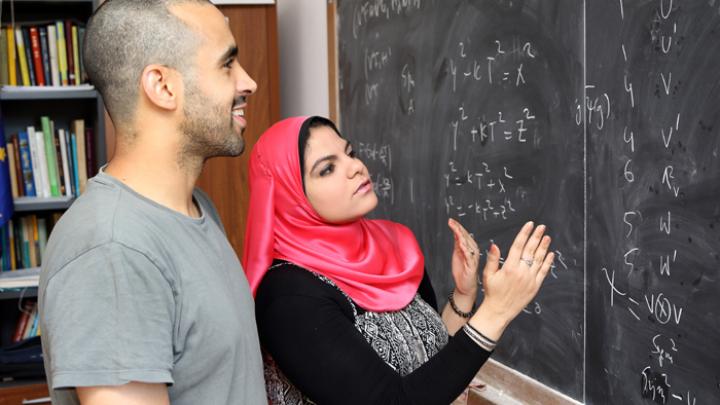 ICTP Postgraduate Diploma student Alaa Elshorbagy with Mathematics postdoctoral fellow Tarig Abdelgadir