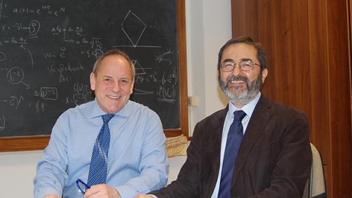 Friends of ICTP President Joseph Niemela with ICTP Director Fernando Quevedo at the signing of an agreement between the two organizations