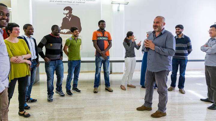 Karim Aoudia with students at ICTP