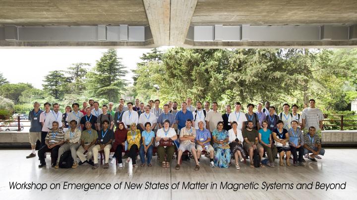 Workshop participants line up outside the ICTP headquarters