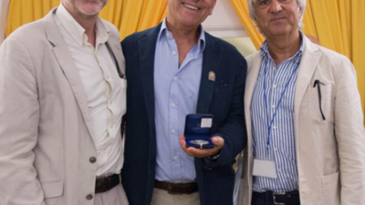 ICTP scientist Joe Niemela (centre) with Francesco Baldini, SIOF  President, and Ivo Rendina, past SIOF President