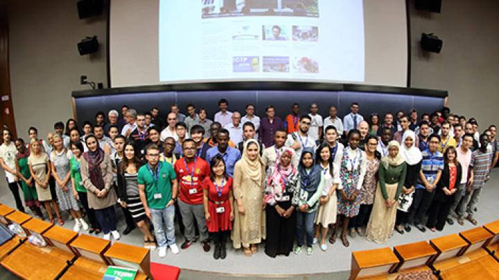ICTP's new Diploma students pose with staff at welcome ceremony