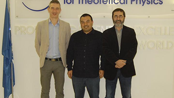 Reyimuaji Yakefu (centre) with his PhD advisor Andrea Romanino (left) and ICTP Director Fernando Quevedo