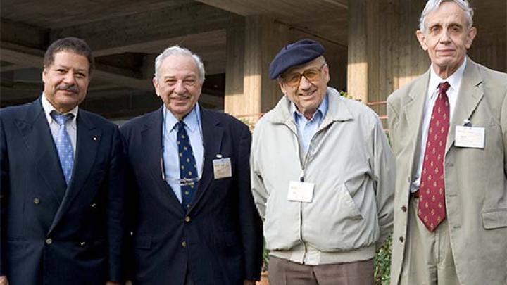 Zewail (far left) with Nobel Laureates Rudolph Marcus, Walter Kohn and John Nash at ICTP's 40th anniversary celebration (ICTP Photo Archives/Massimo Silvano)