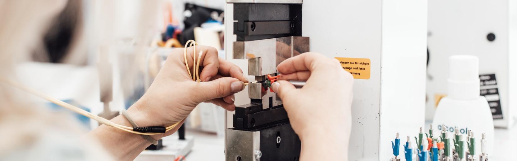 Woman working with a fibre optic cable